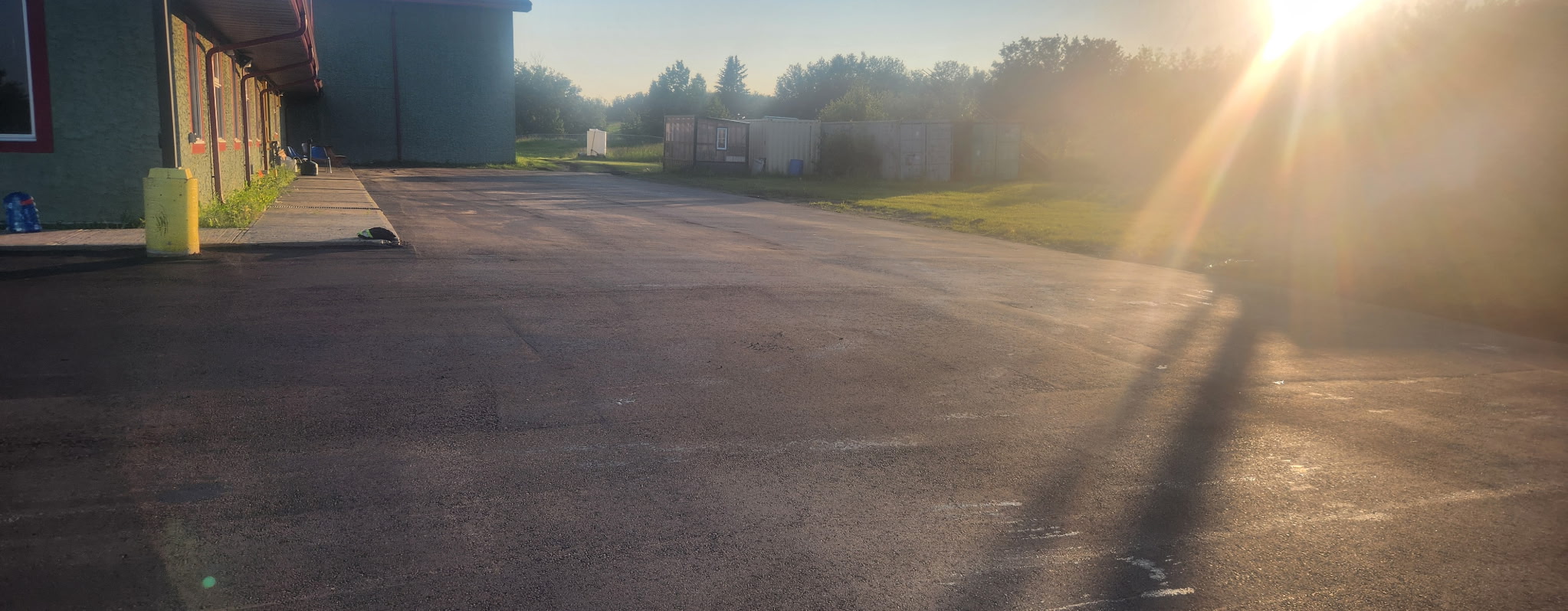 Finished asphalt lot at sunset