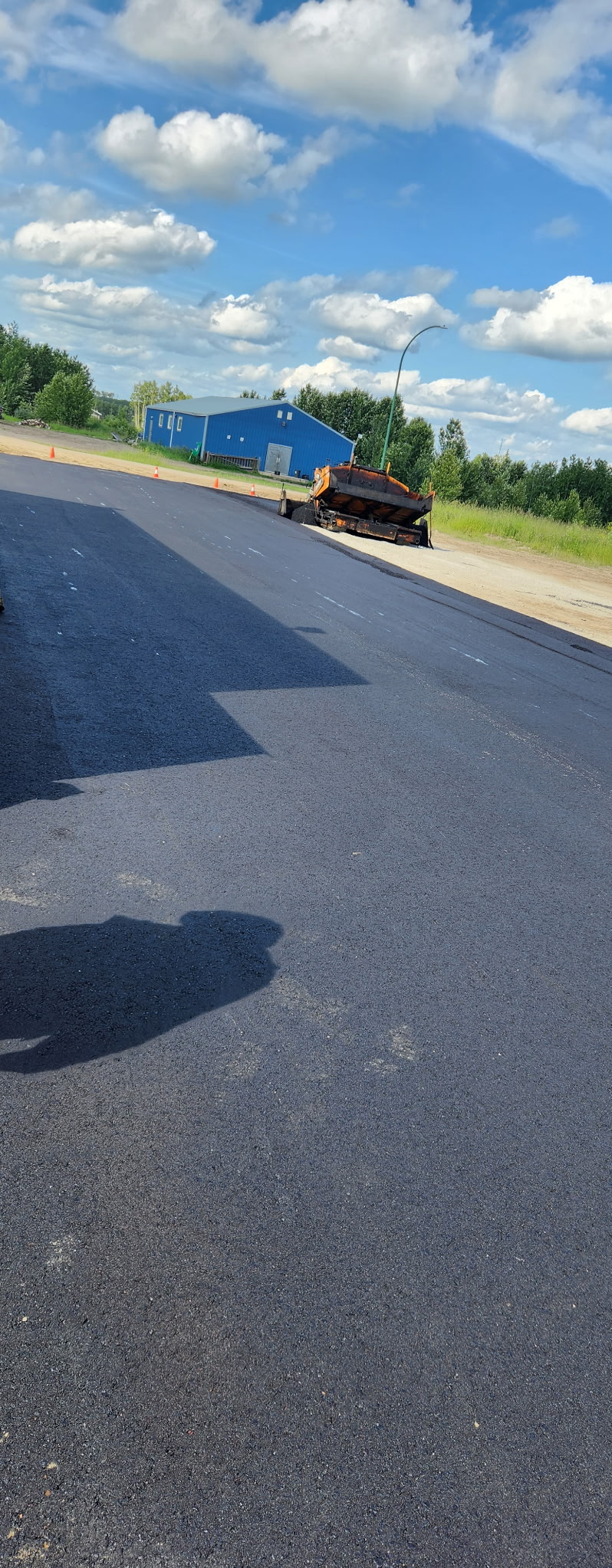 Paver laying hot-mix asphalt
